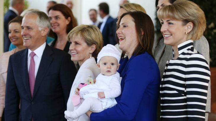 Kelly O'Dwyer's daughter Olivia joined the women in the ministry photo with Prime Minister Malcolm Turnbull and Julie Bishop after the swearing in ceremony at Government House on Monday September 21. Photo: Andrew Meares