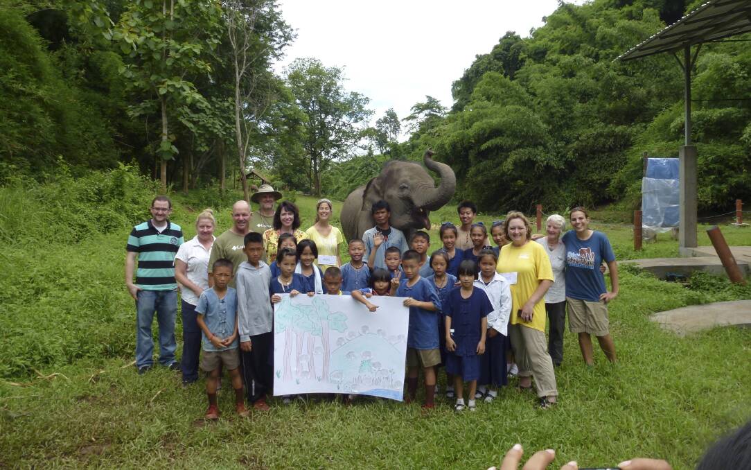 Stuart and Cheryl DeLandre, of Windang, studied the intelligence of elephants on an EarthWatch project in Thailand, and are among other EarthWatch volunteers, research assistants, a class of Thai students and teachers. Picture: SUPPLIED