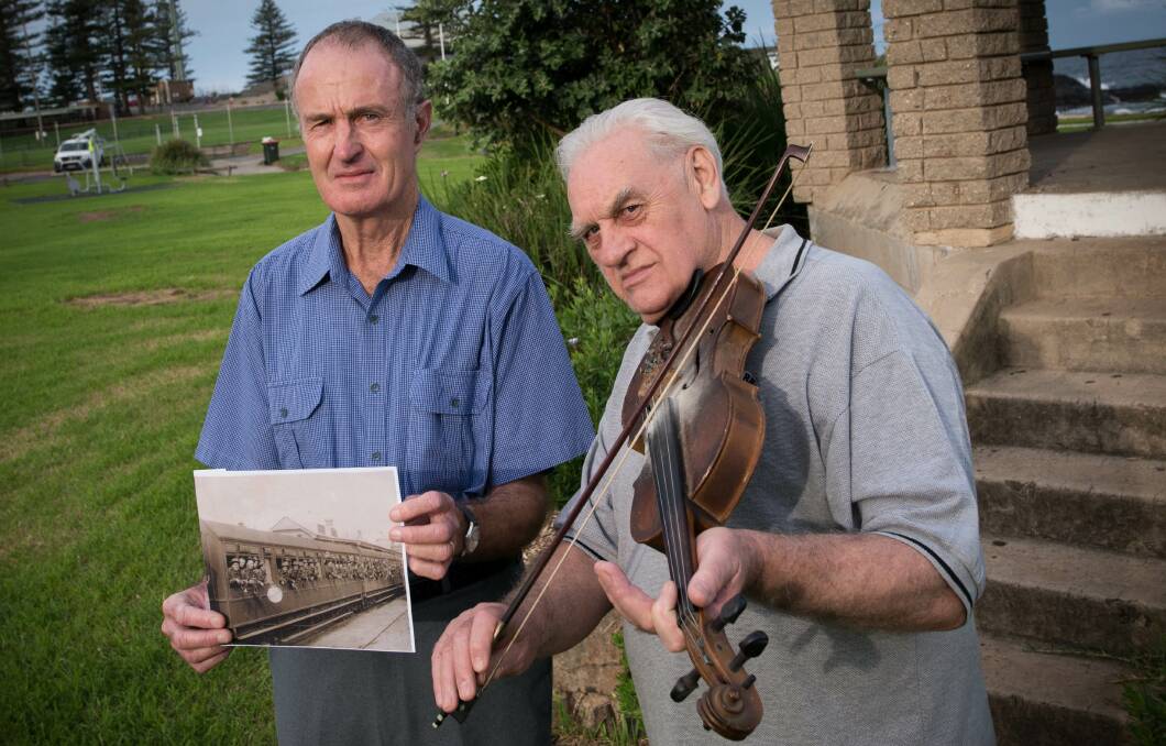 Peter Mitchell has composed a song about Kiama residents who have served in the military during various conflicts. He is accompanied by Bill Montgomery (Illawarra Folk Club) on violin. Picture: ALBEY BOND