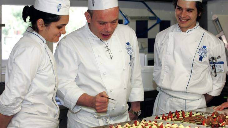 Icing on the cake: A chef tutors students in the finer points of presentation at Le Cordon Bleu International. Photo: Le Cordon Bleu International