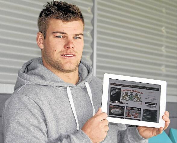 Gerringong's Ethan Ford checks out Plymouth Albion's website before he heads to England. Picture: DAVID HALL