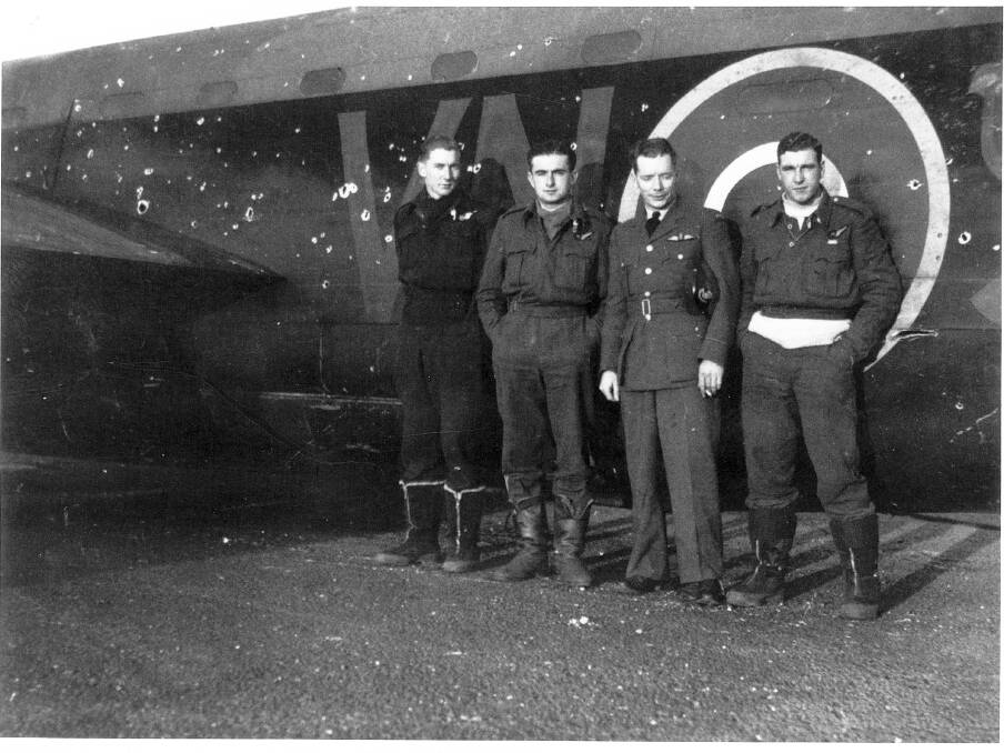 Allan Connor (left) with his crew from the infamous bombing raid on Hamberg and their bullet-riddled plane.Photo1.jpg