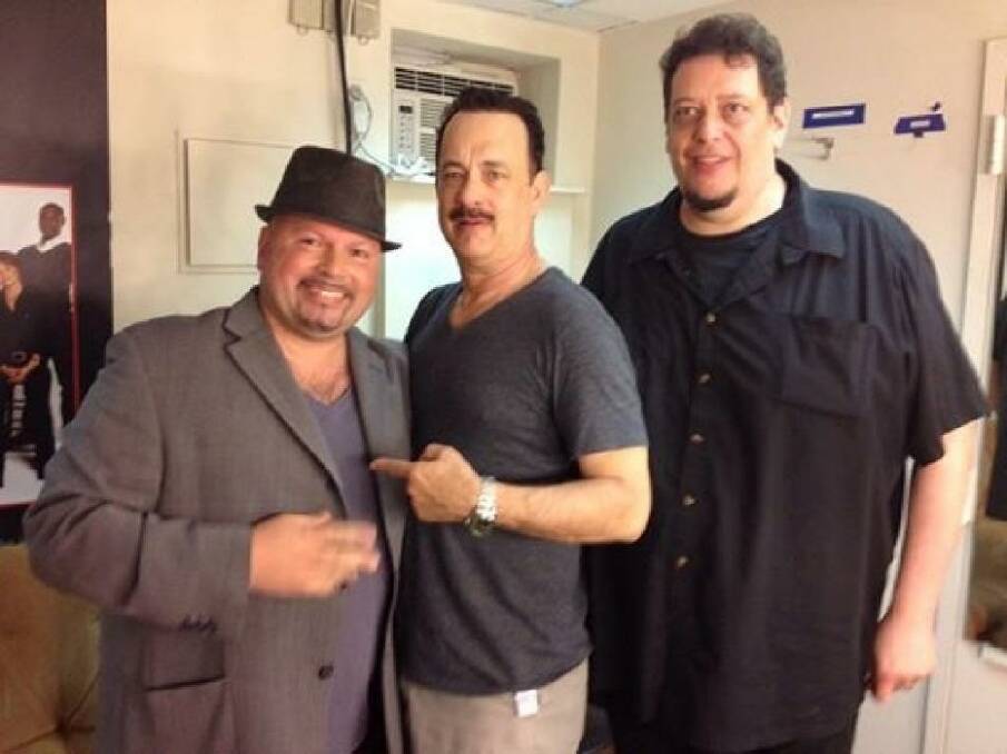 Manny Anzalota posing backstage with Tom Hanks after seeing his show, Lucky Guy.  Photo: Facebook