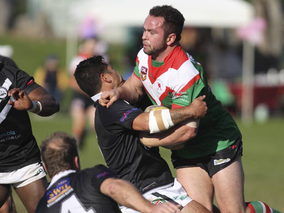 Jamberoo Superoos rampaging prop Luke Gilmore proving a handful for Port Kembla five-eighth Christian Kupenga during their sides' clash at Kevin Walsh Oval on Sunday. Picture: DAVID HALL