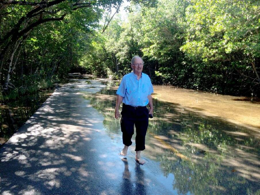 Rising concern: Geologist Harold Wanless takes a stroll through flooded Miami streets.