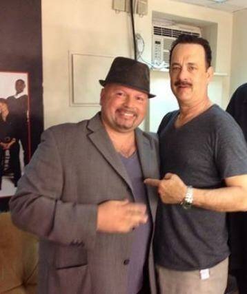 Manny Anzalota posing backstage with Tom Hanks after seeing his show, Lucky Guy.  Photo: Facebook