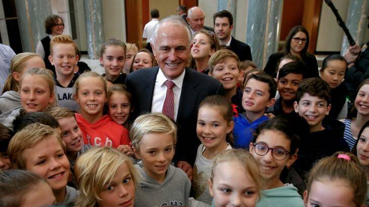 Malcolm Turnbull meets children in the Parliament House foyer after addressing the public service on Wednesday.  Photo: Alex Ellinghausen