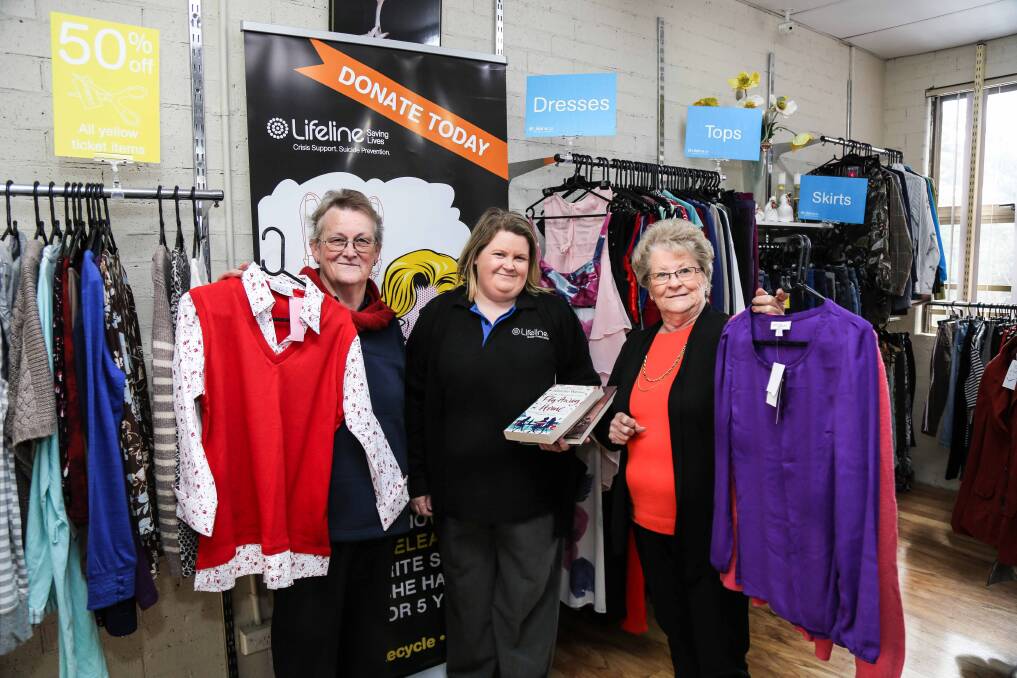 Lifeline Kiama volunteer co-ordinator Rose Cook with volunteers Jenny Smith and Edna Campbell preparing for National Op Shop Week. Picture: GEORGIA MATTS