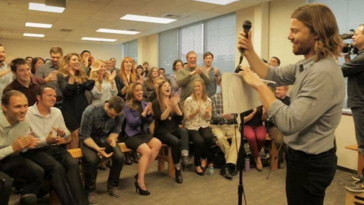 We're in the money: Gravity employees react after being delivered the news. Photo: The New York Times