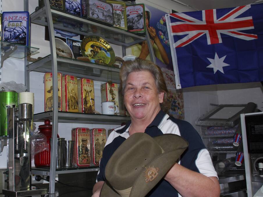 Harbour View Takeaway's Debbie Crouch with part of her array of Anzac memorabilia at her Shellharbour business. Picture: DAVID HALL