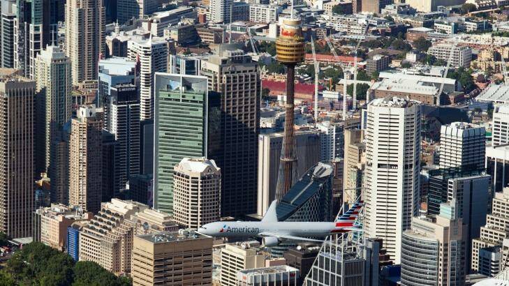 American Airlines' new Boeing 777 performs a flyover of Sydney's CBD to mark the airline's return to Australia. 