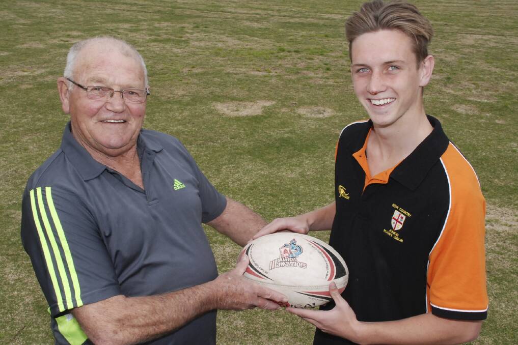 Shellharbour Sports Assistance Fund chairman Don Briggs with NSW Country under-18 Rugby representative and fly-half Ryan Sorrell, following the presentation of a cheque for $1200 to help Sorrell compete in Spain as part of the NSW Country under-18 team next month. Picture: DAVID HALL