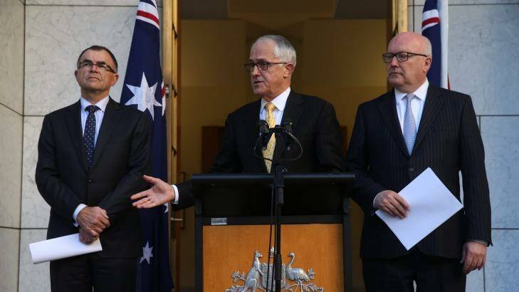 Prime Minister Malcolm Turnbull and Attorney-General George Brandis announced Brian Ross Martin as Royal Commissioner on Thursday. Photo: Andrew Meares