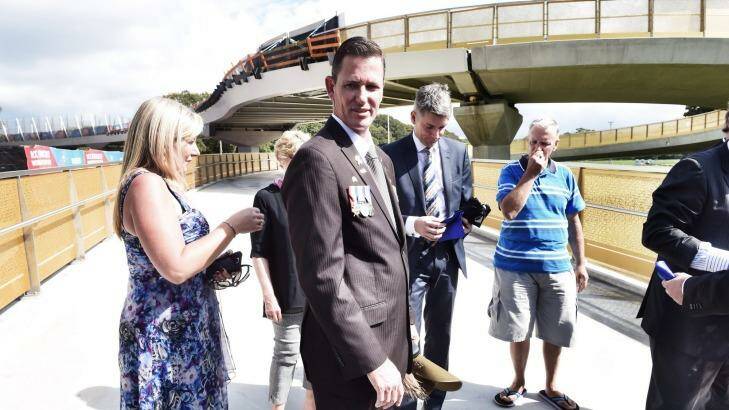 Afghanistan veteran Scott Tate, wearing his relatives' medals earned in World War I and his own, attended the official opening of the  Albert "Tibby" Cotter walkway.  Photo: Nick Moir