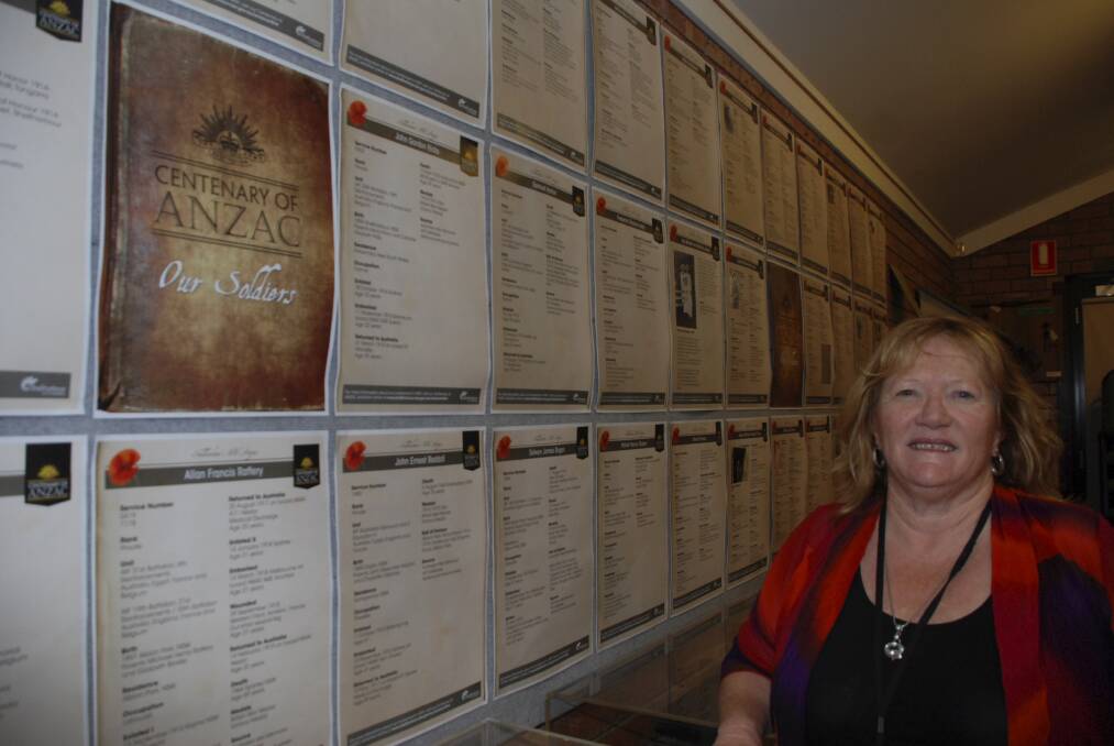 Shellharbour City Mayor Marianne Saliba with the exhibition honouring the region's World War I soldiers at the Tongarra Bicentennial Museum. Picture: PHIL McCARROLL