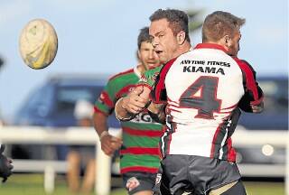 Jamberoo front-rower Luke Gilmore gets a pass away despite some heavy attention from Kiama Knights centre James Brown during Saturday's 30-28 thriller at Kiama Showground. Picture: DAVID HALL