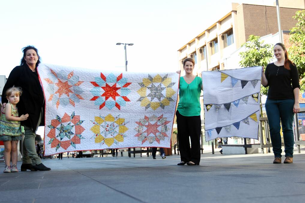 Wollongong Modern Quilt Guild members Fiona and Laura Mannion, Rachael Letham and Jessica Hull want people to attend their show in Kiama this weekend. Picture: SYLVIA LIBER.