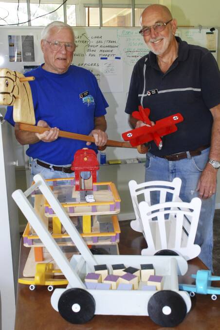 Men's Shed's Morrie Veness and John Mennie with some of the toys they helped make for sale at Christmas. Picture: DAVID HALL