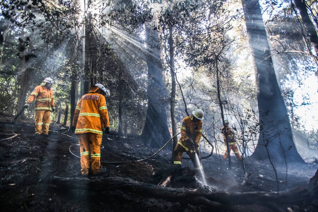 Rural Fire Services help put out a fire near Fountaindale Road, Jamberoo on Wednesday. Picture: DYLAN ROBINSON