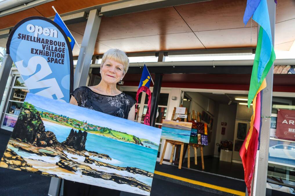 Kay Norington with her painting of Kiama's Cathedral Rocks. Her works are on display at Shellharbour Village from January 20. Picture: GEORGIA MATTS