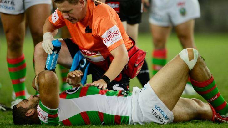 Out: Souths star Greg Inglis was knocked out in the opening minutes of the game against Wests Tigers and spent the rest of the match in the sheds. Photo: Getty-Images