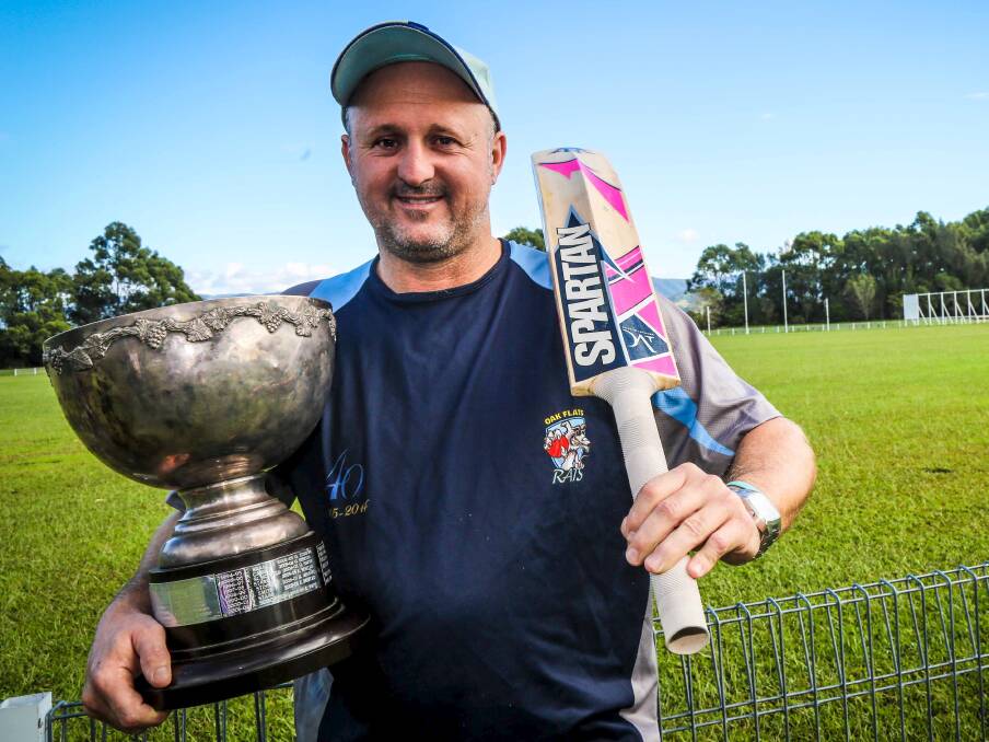 Flats opening batsman Kerry Penfold proudly shows off the Noble Family Trophy for South Coast Cricket Association Player of the Year - the third time he has won the award. Picture: GEORGIA MATTS