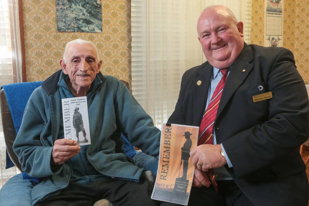 Doug Rymer and Warwick Hansen have had booklets about the traditions of Anzacs re-printed for schools and other interested groups in the community. Picture: ADAM McLEAN