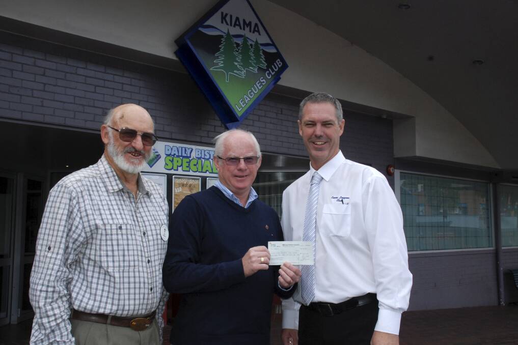 Local Legacy members Ken Kelly and secretary Les Green with Kiama Leagues Club General Manager Peter Wright and the cheque for funds raised by the club on Anzac Day. Picture: DAVID HALL