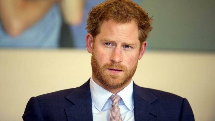 Britain's Prince Harry has condemned racist abuse and harassment of his girlfriend Meghan Markle in the media. Photo: Matt Dunham