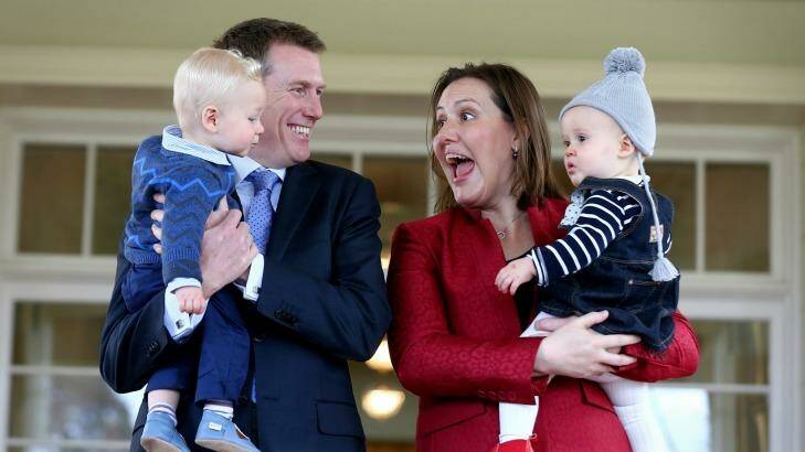 Minister for Social Services Christian Porter with his son Lachlan and Minister for Revenue and Financial Services Kelly O'Dwyer with her daughter Olivia at the ministerial swearing ceremony at Government House in Canberra in July. Photo: Alex Ellinghausen