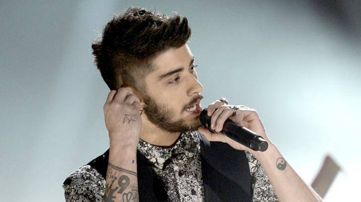 One Direction's Zayn Malik allegedly broke up with his fiancee via text. Photo: Kevin Winter