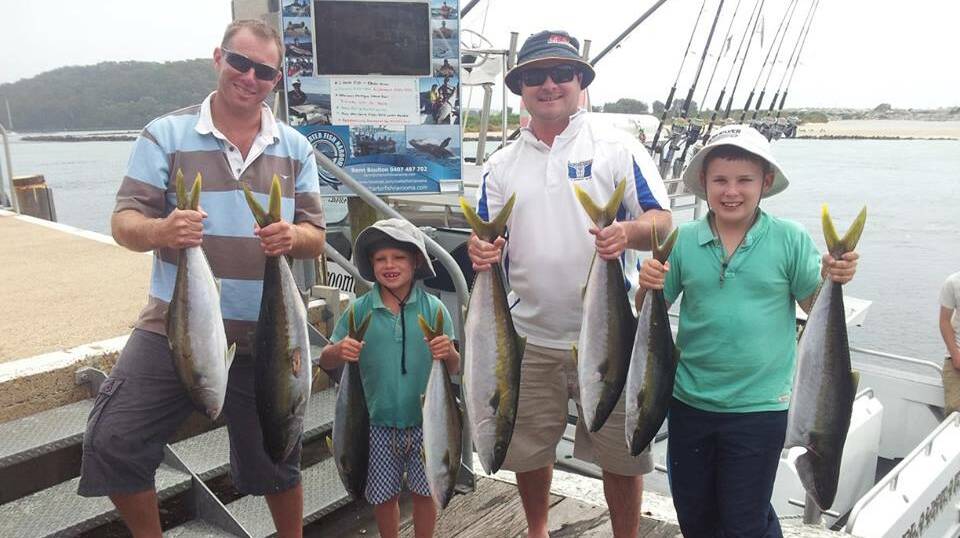 GOOD DAY: Nathan and Archie Stoll, Ben and Fergus Howard from Wagga managed 10 legal kingfish (between 6 and 7kg) on the Playsation on Thursday at Montague Island where the water colour and temp had improved - mostly taken on jigs. (15/2/2014)