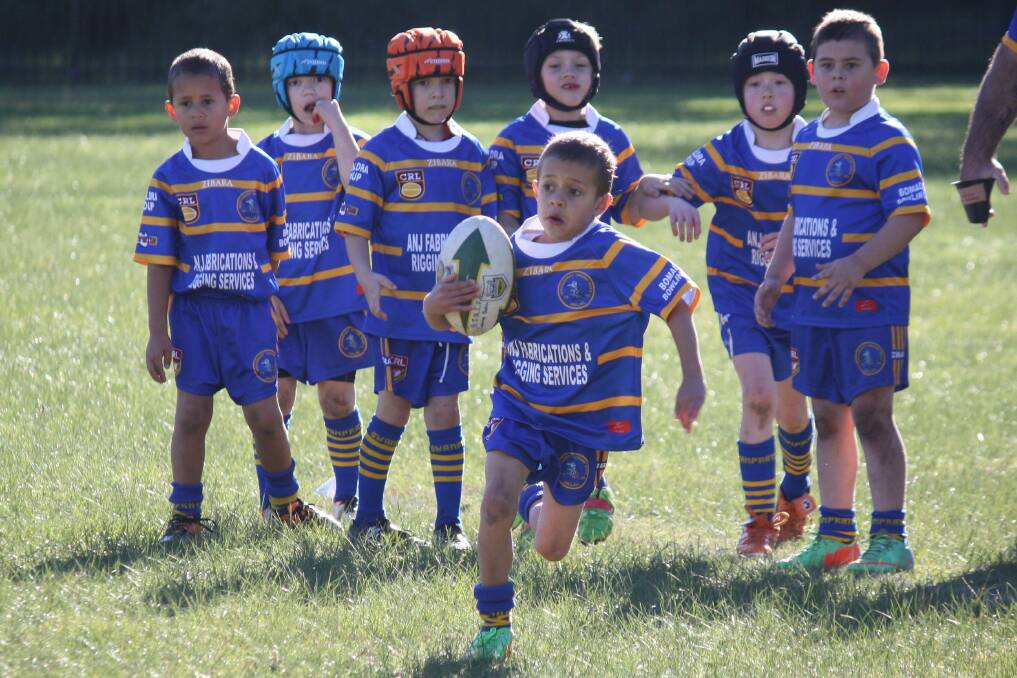 BREAKOUT: Bomaderry u7 player Jarrah Thomas runs the full length of the field to score his try.  