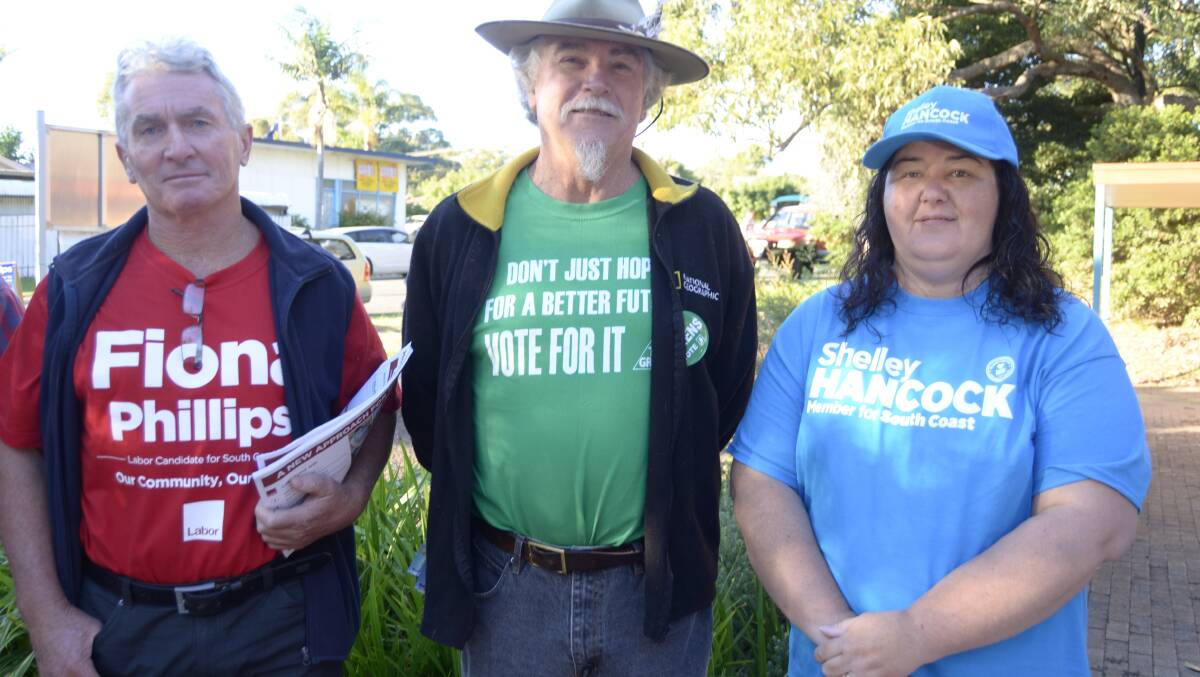 Michael Pearce from Huskisson, Roger Hart from Woollamia and Sam Luxford from Nowra hand out pamphlets to voters at Huskisson Community Centre on Saturday.