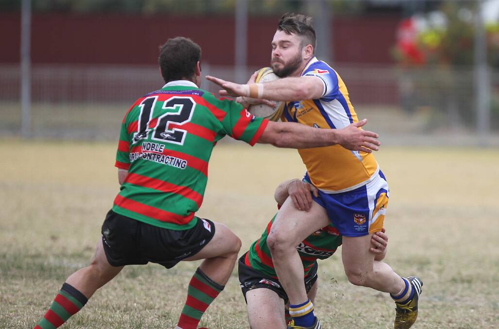 DON’T ARGUE: Warilla-Lake South winger Craig Nolan tries to break free of the Jamberoo defence during his side’s 30-14 win on Saturday. Photo: DAVID HALL  