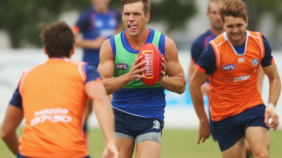 Shaun Higgins runs with the ball during a North Melbourne Kangaroos AFL media session at Arden Street Ground on February 17, 2016. Pic: Michael Dodge/Getty Images