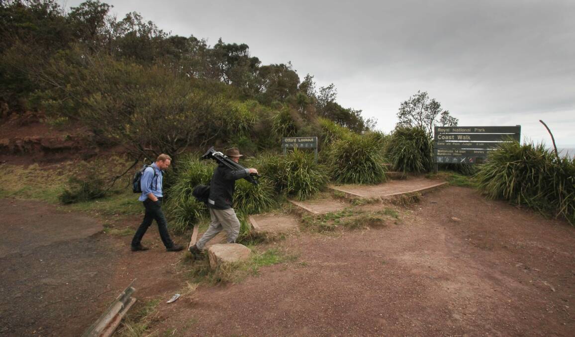 A news crew prepare to make the two kilometre walk to Werrong Beach from Otford where the body of a man was located late last night on a bush track. Picture: KIRK GILMOUR