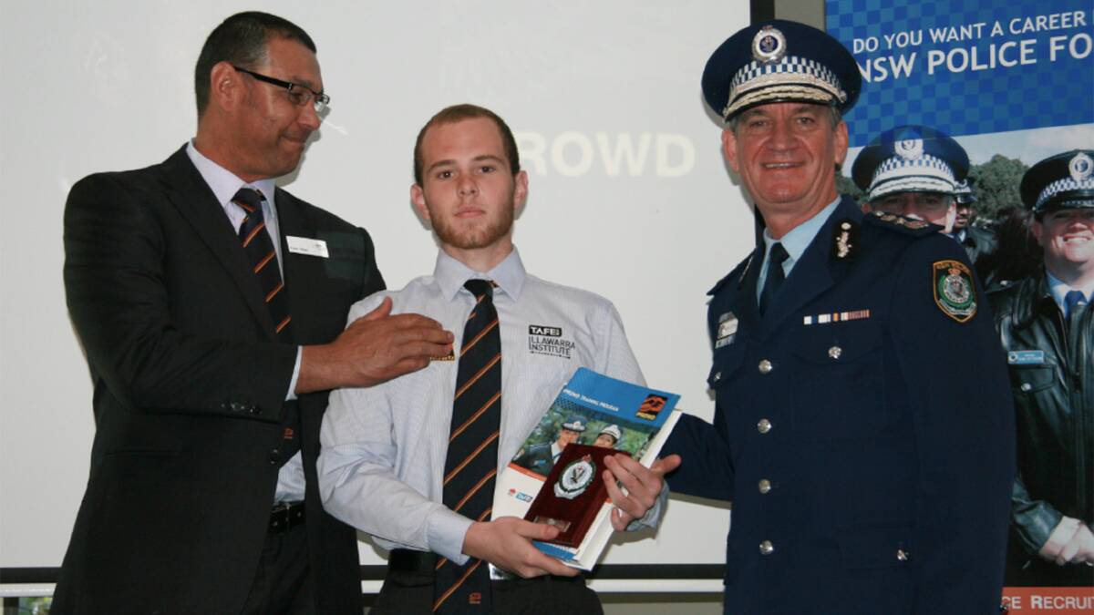 Steven Poole accepting the Annual Gibbs Award with IPROWD State Manager Peter Gibbs, and NSW Police Commissioner Andrew Scipione. 