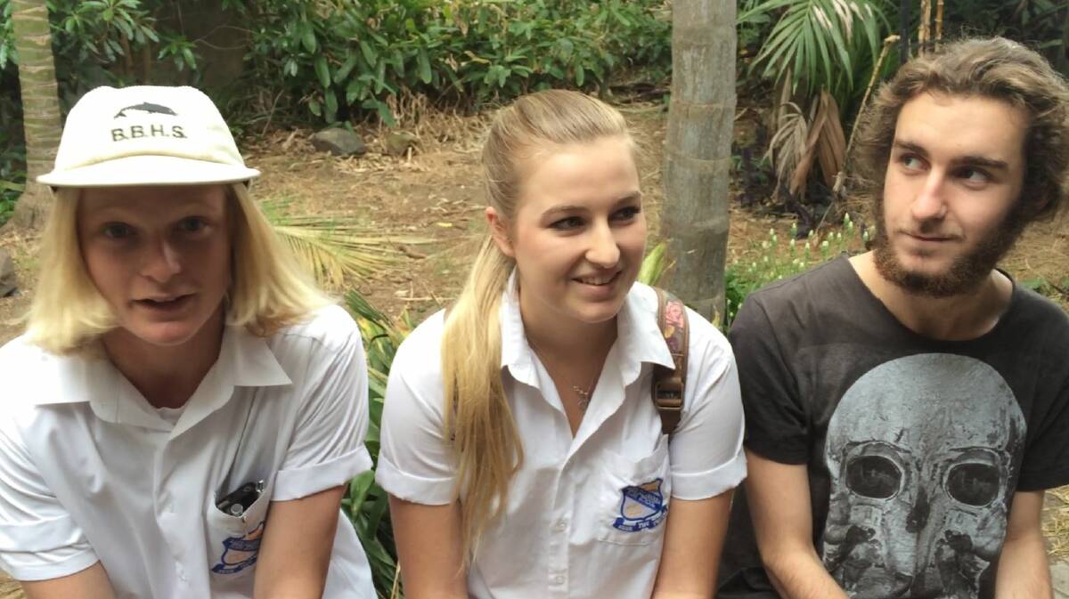 Lake Illawarra High School students Billy Fleming, Emily Karagiammis and Dane Kennedy sit back after their first exam. By Eliza Winkler