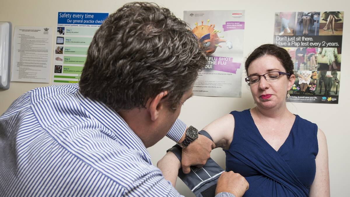 Eleonor Prichard, who is in her final trimester of pregnancy, has a consultation with Dr Martin Liedvogel following the announcement of free whooping cough shots for pregnant women. Photo published in Canberra Times. Taken by Matt Bedford