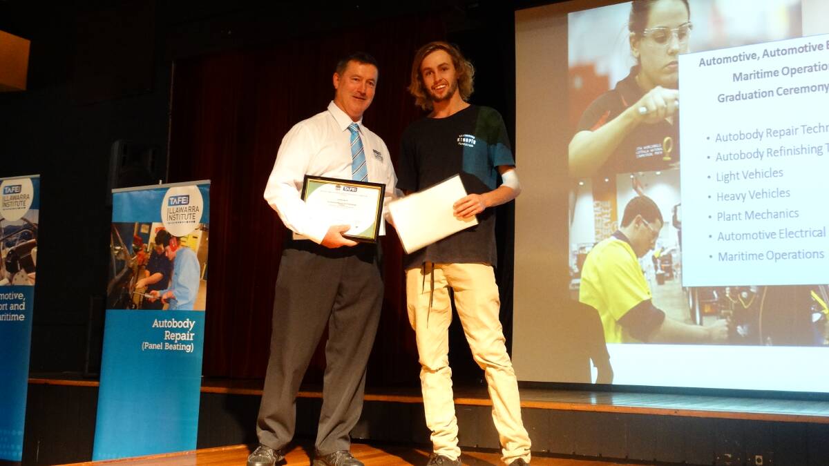 Illawarra teacher Chris Baham with graduate Brad Mcclelland of Shellharbour, who completed a Certificate III in Mobile Plant Technology.