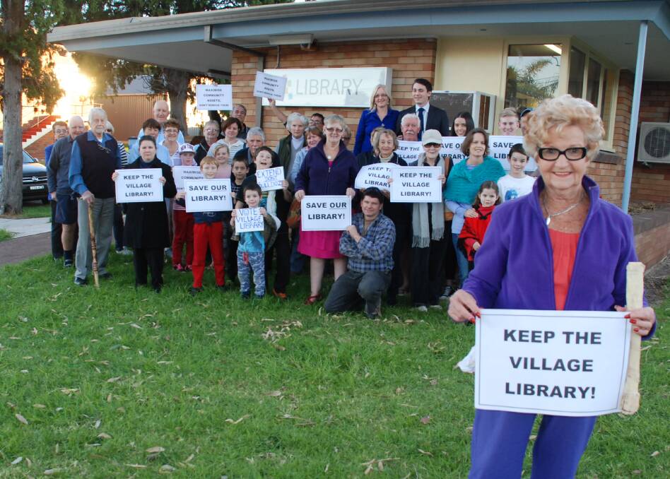 Shellharbour resident Patricia Wickham gathered with other residents at the Shellharbour Village library on Friday last week to rally against any proposals to move it to Shell Cove. Picture: Eliza Winkler