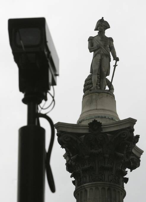 Backdropped by a London landmark, Nelson's Column, in Trafalgar Square, a closed-circuit surveillance camera keeps watch, in central London. Picture Lefteris Pitarakis