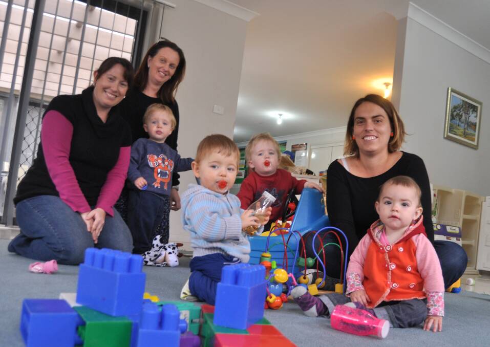 Shell Cove playgroup members Emma Reitsma, Deanna Breasley (treasurer) and Belinda Margetts (co-ordinator) with their children at the weekly playgroup. Picture Eliza Winkler
