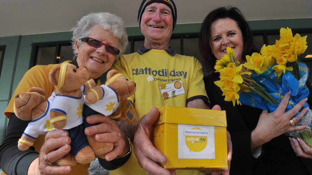 Cancer Council volunteers Helen Bent and Noel Dare with Shellharbour MP Anna Watson at the Woolworths at Shellharbour City. Picture Eliza Winkler