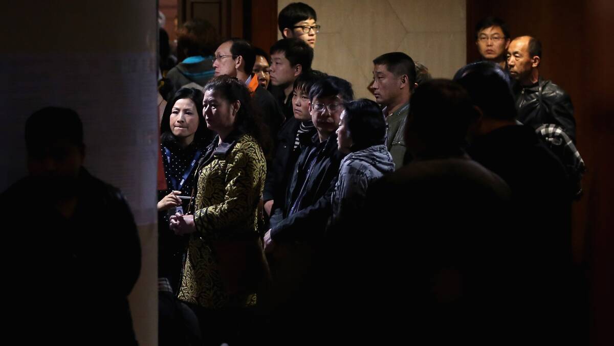 Chinese relatives of the passengers onboard Malaysia Airlines flight MH370 wait for the latest information in Beijing, China. Pic: Getty Images.
