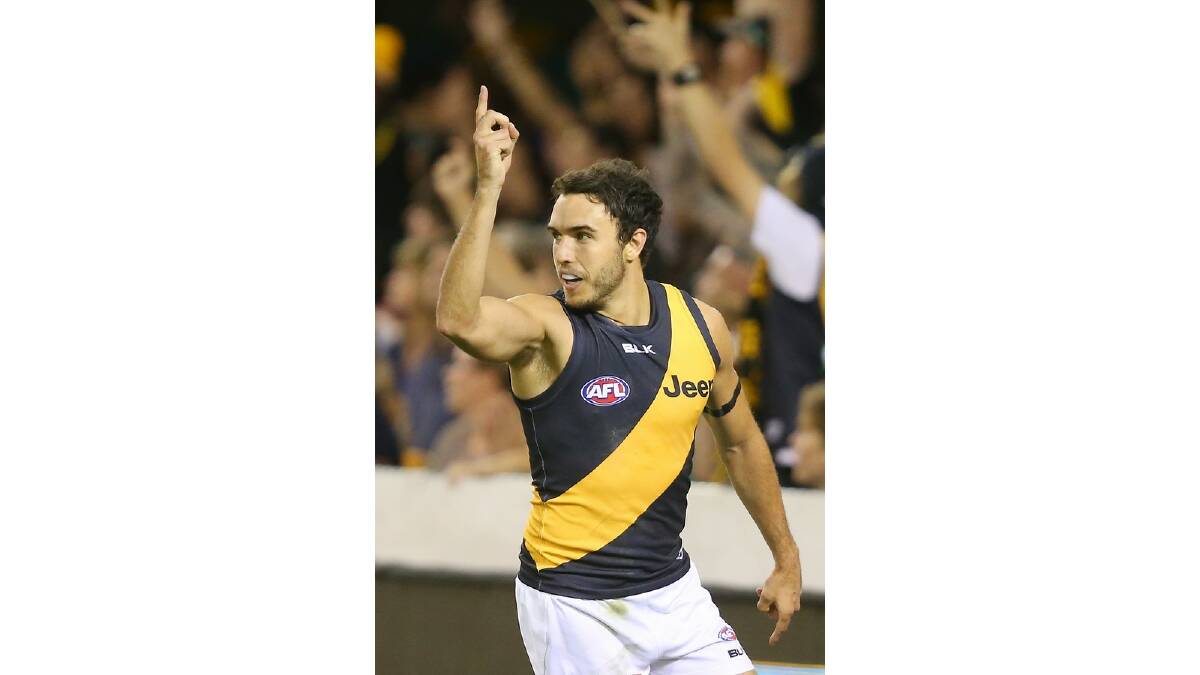 Shane Edwards of the Tigers celebrates after kicking a goal during the round five AFL match between the Brisbane Lions and the Richmond Tigers at The Gabba on April 17, 2014 in Brisbane, Australia. Photo: Chris Hyde/Getty Images.