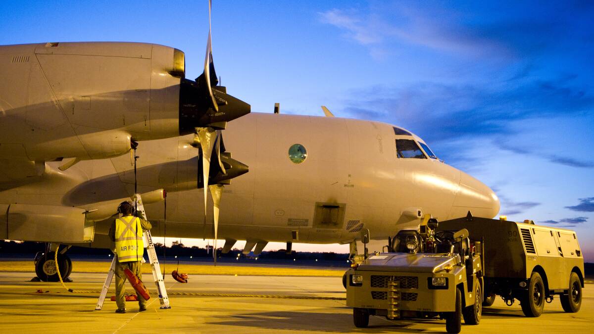 A Royal Australian Air Force AP-3C Orion aircraft from 10 Squadron, No 92 Wing, has post-flight checks conducted by maintenance personnel. Pic: Getty Images.