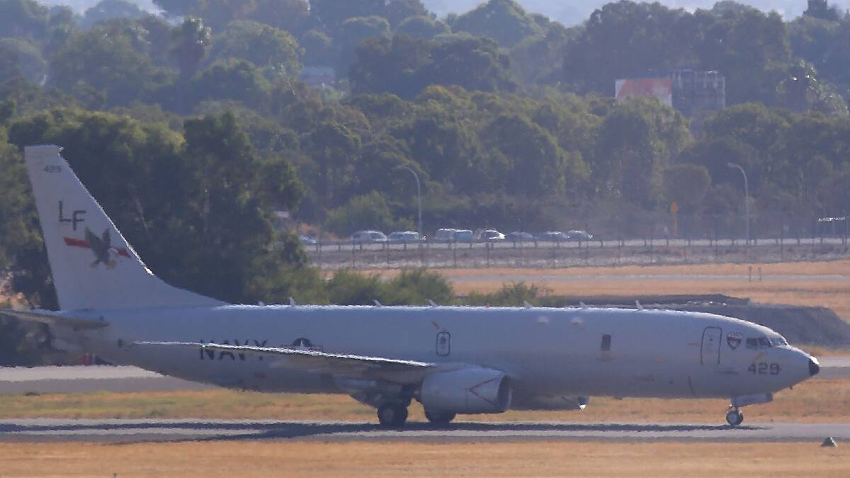 A US Naval surveillance aircraft invloved in the search for the missing Malaysian Airlines flight MH370 is seen after landing at Perth airport on March 19. Pic: Getty Images.