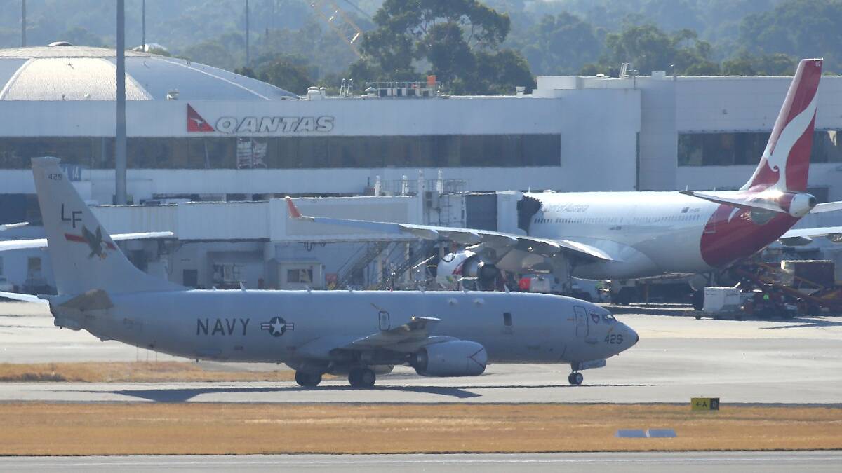A US Naval surveillance aircraft invloved in the search for the missing Malaysian Airlines flight MH370 is seen after landing at Perth airport on March 19. Pic: Getty Images.